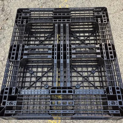 Colorful plastic pallets stacked for recycling