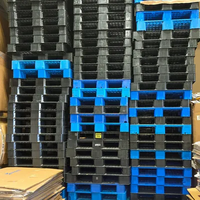 Blue and black plastic pallets