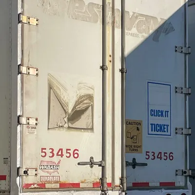 Worker handling pallets at the facility