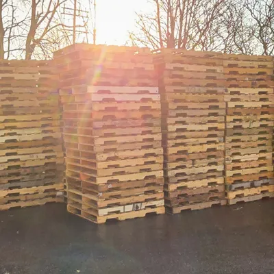 Pallets stacked on facility grounds