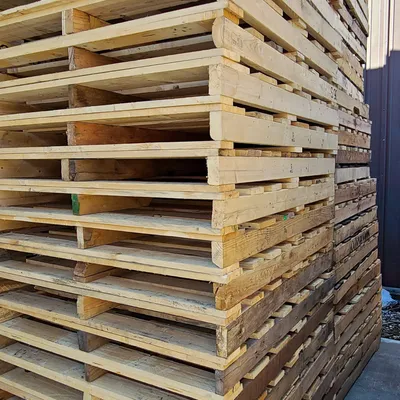 Reclaimed wood pallets in storage