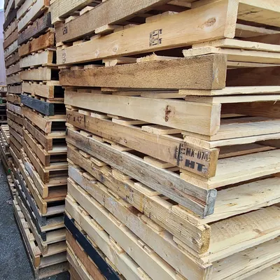 Neatly stacked recycled pallets