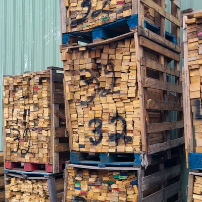 Repaired pallets stacked for pickup