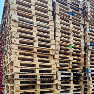 Stacks of used pallets for recycling