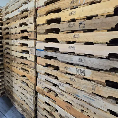 Pallets stacked outdoors at facility